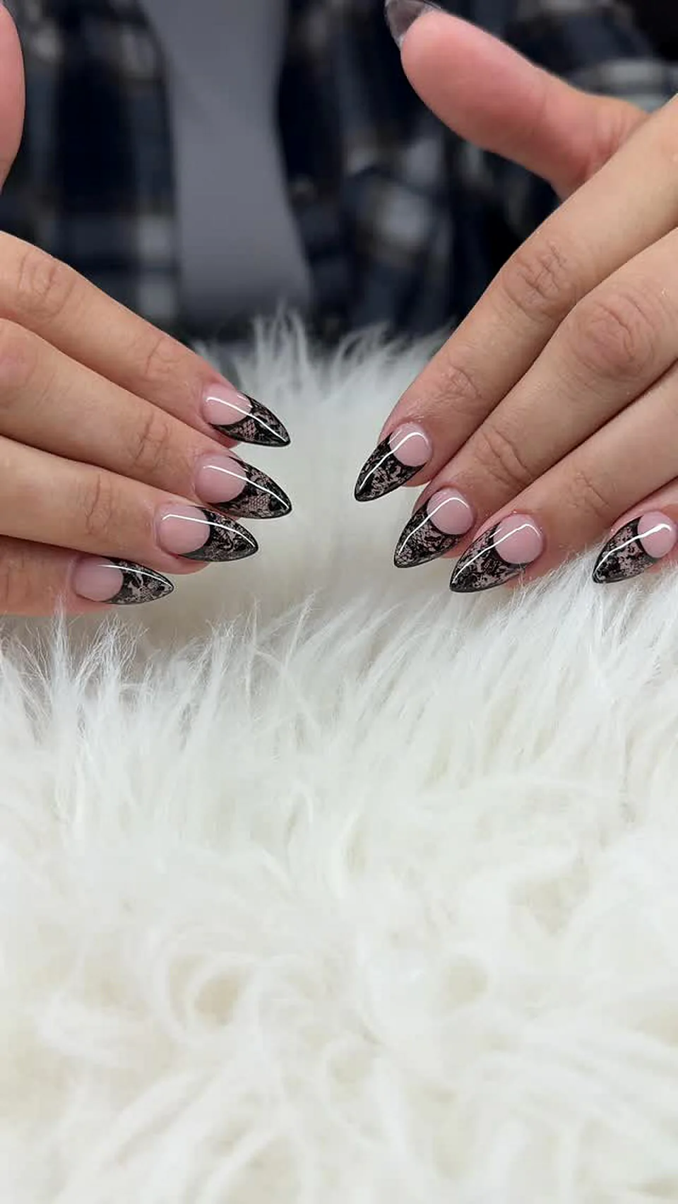 Black stiletto nails with white hand-painted line art done at Attraction Nails Salon in Roselle Park, NJ