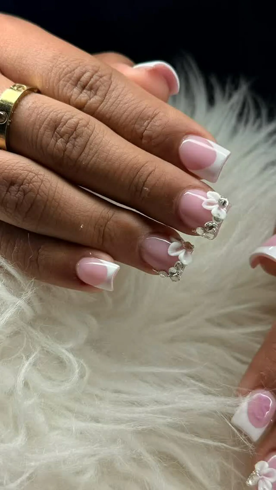 Pink French nails with hand-sculpted white 3D flowers and rhinestones, Attraction Nails Salon Roselle Park NJ