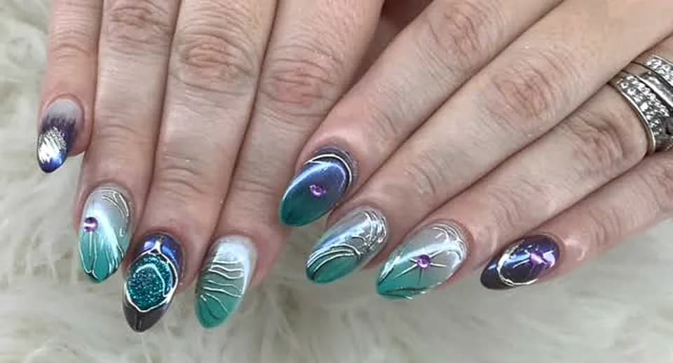 Close-up of teal and silver chrome nails done at Attraction Nails Salon in Roselle Park, NJ