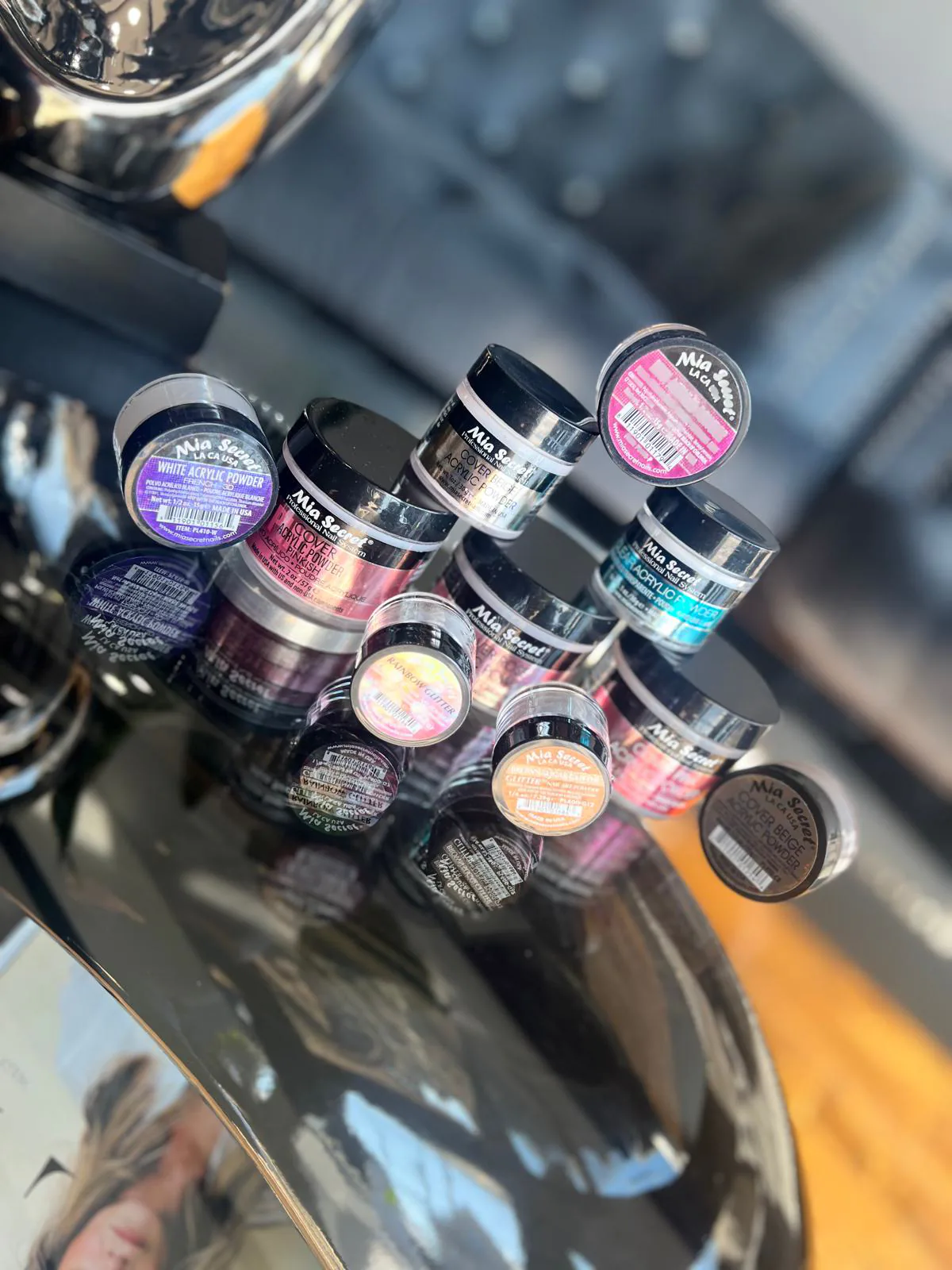 Dip powder jars in assorted colours at Attraction Nails Salon