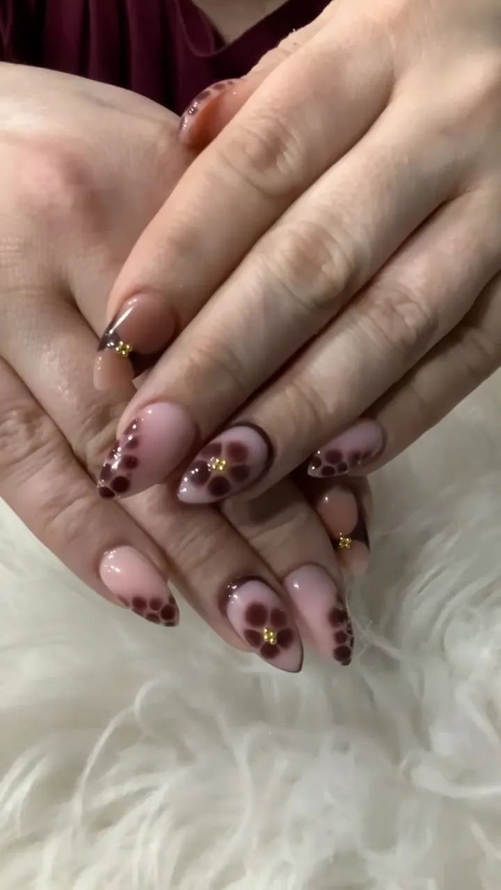Video of leopard print nails with sculpted 3D flowers