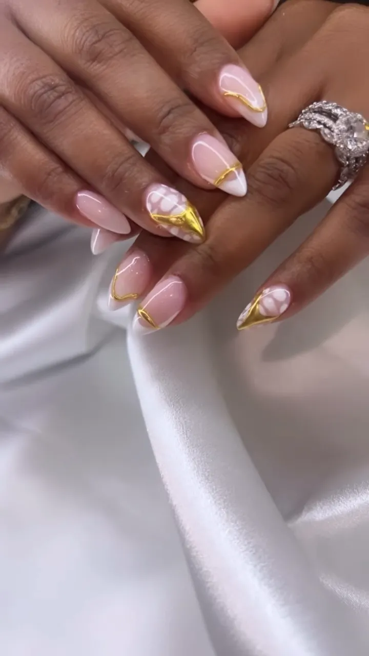 Video of nude nails with gold foil accents on satin